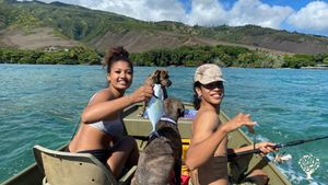 my daughter and bf fishing in front of the house, Mapulehu