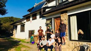 Wwoofer and friends. The natural construction in stones and mud is part of our work