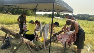 Our community learning to tan hides.