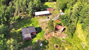 Our property a few years ago with the main house (left), and the tiny house behind the large barn