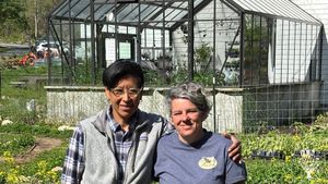 Danika and L in front of the greenhouse.