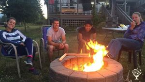 Wwoofers hang-out in back yard by the fire pit