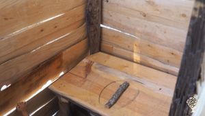 Our very rustic compost toilet by the camp — basic, handmade and part of off-grid life.