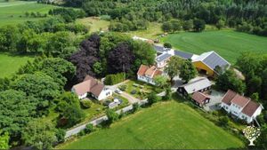 Our farm, with mainhouse to the left.  Parents to the right, daughter and boyfriend in the middle.