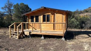 Christian Camp for Children off grid. Chickens, dogs, and cats. Off grid.mountainous wilderness.