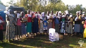 Giving out food to our widows 