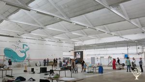 Art exhibition in the big hall in the factory.