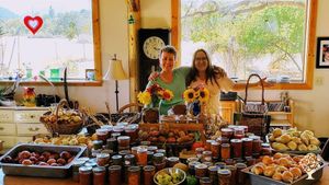 Kate and Kelpie, neighbors and garden partners, with harvest.